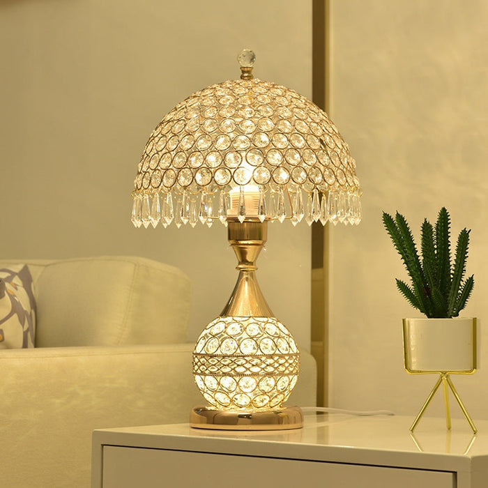 Elegant gold crystal desk lamp with remote control switch on bedside table